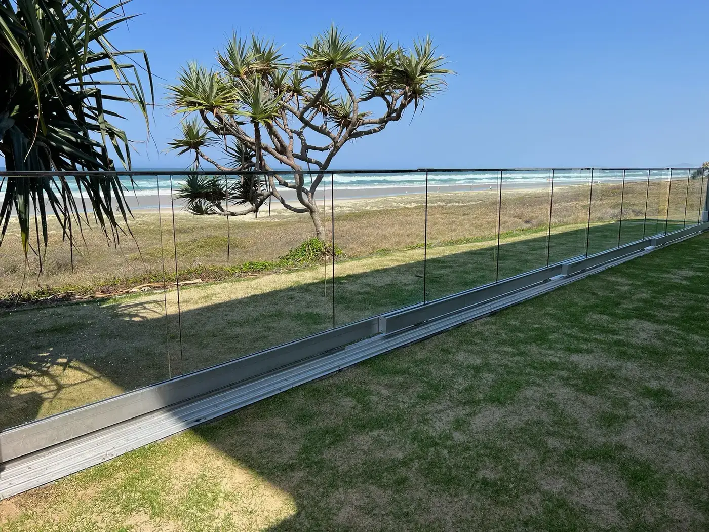 Coastal glass balustrade exposed to salt spray