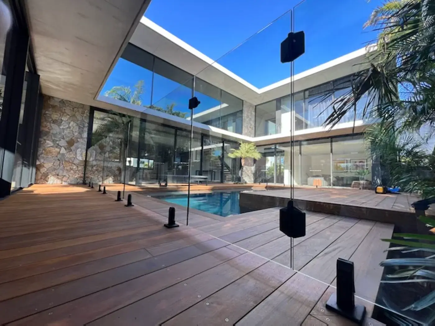 Glass Armour nano coating applied to frameless pool fencing at a luxury courtyard home