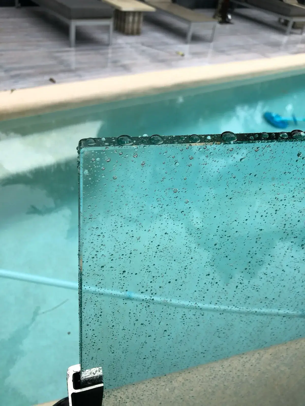 Water beading on a Glass Armour nano-coated pool fence