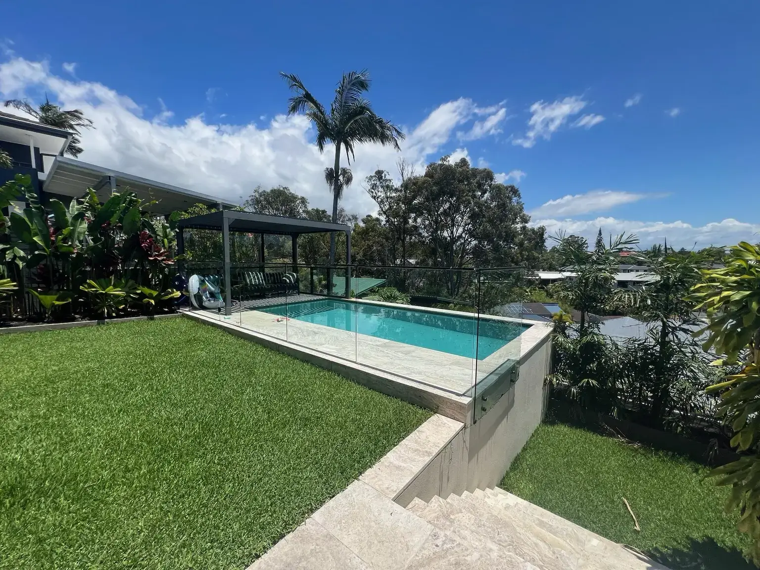 Frameless glass pool fence at a premium home