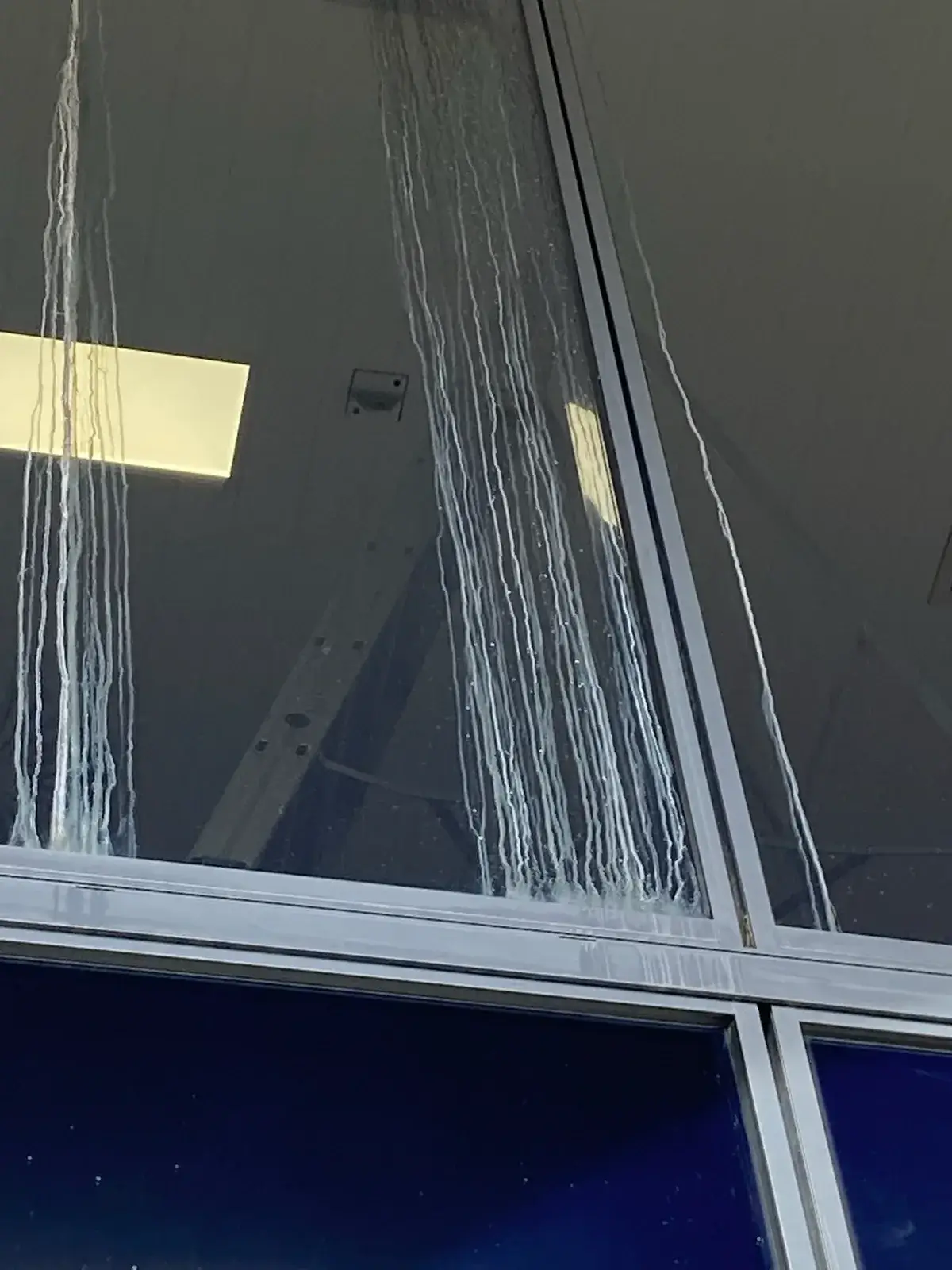 Heavy mineral streaking on commercial glass before restoration